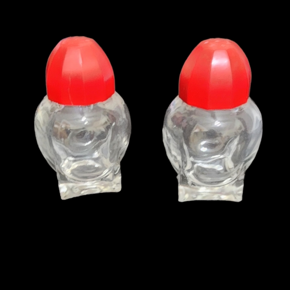 Vintage mid-century salt and pepper shakers with red screw on caps